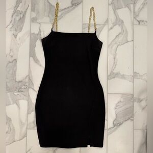 Black mini dress with gold chain straps